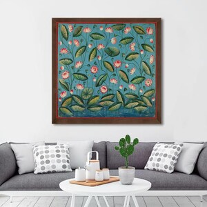 May include: A framed painting of a blue background with pink and white lotus flowers and green leaves. The painting is in a brown frame.