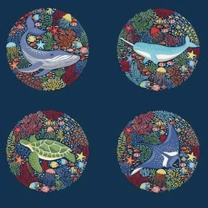 May include: A navy blue pattern featuring circular illustrations of marine animals such as a dolphin, octopus, whale, narwhal, sea turtle, manta ray, orca, and a spotted whale. Each circle is filled with colourful coral and sea life.