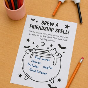 May include: A white activity sheet titled BREW A FRIENDSHIP SPELL! featuring a black line drawing of a cauldron with bubbles and bats. Inside the cauldron, the blue text reads Kind words, Shares, Includes, Helpful, and Good listener.