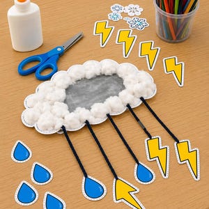 May include: A craft project featuring a central cloud shape covered in white cotton balls, with four dark blue yarn strings hanging down. Attached to the strings are blue raindrop and yellow lightning bolt cutouts. Nearby are glue, scissors, and coloured pencils.