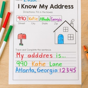 May include: A worksheet titled "I Know My Address" with the name "Evan" written at the top. The worksheet includes fill-in-the-blank sections for street, city, state, and zip code, along with a drawing of a house and a mailbox.