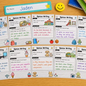 Pode incluir: Uma coleção de folhas de trabalho de escrita de opinião com ilustrações e prompts, incluindo tópicos como regras escolares e sobremesa. O nome "Jaden" está escrito em uma etiqueta de identificação. Marcadores coloridos, lápis de cor e um smiley também são visíveis.