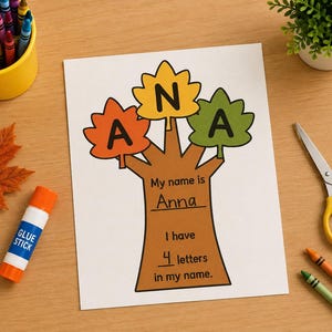 May include: A white paper craft sheet featuring a brown tree illustration with three colorful leaves in orange, yellow, and green. Each leaf displays a black letter spelling ANA. The trunk includes the text My name is Anna and I have 4 letters in my name.