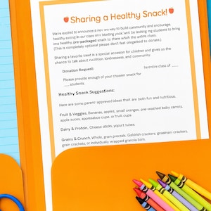 May include: An orange folder with a document titled "Sharing a Healthy Snack!" is open on a blue surface. The document includes snack suggestions and a donation request. Crayons and scissors are in the image.