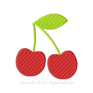 May include: Embroidered design of two red cherries with green stems and a green leaf. The cherries are a vibrant red color, and the leaf is a bright green. The text "Island Girl Appliques" is at the bottom.