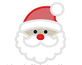 May include: Embroidered Santa Claus face with a red and white zig-zag patterned hat, a white beard, and a red nose. The text "Island Girl Appliques" is below the image. This design is perfect for holiday crafts.
