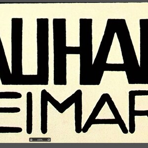 May include: A black and white graphic design featuring the words "BAUHAUS WEIMAR" in bold, sans-serif font. The text is centered on a cream-colored background. The width is 23.386 inches and the height is 13.108 inches.
