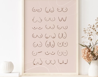 May include: A rectangular wall art print in a light wooden frame featuring a grid of various brown line-drawn illustrations of breasts on a pale pink background. The print includes diverse shapes and sizes, with one illustration showing a surgical scar.