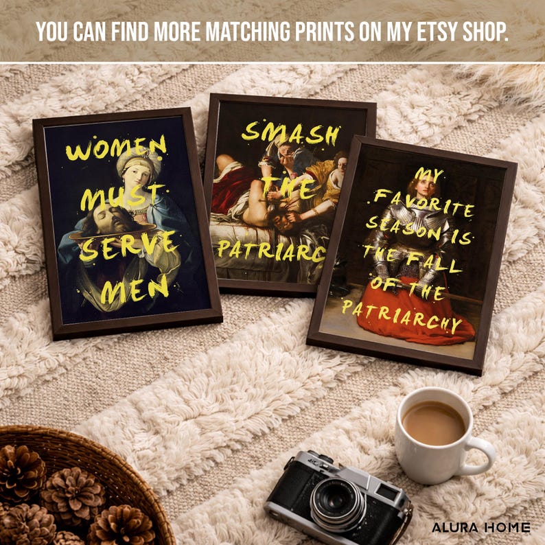 May include: Three framed art prints with dark brown frames. The prints feature classical paintings with yellow text overlaying them. The text reads "WOMEN MUST SERVE MEN", "SMASH THE PATRIARCHY", and "MY FAVORITE SEASON IS THE FALL OF THE PATRIARCHY".
