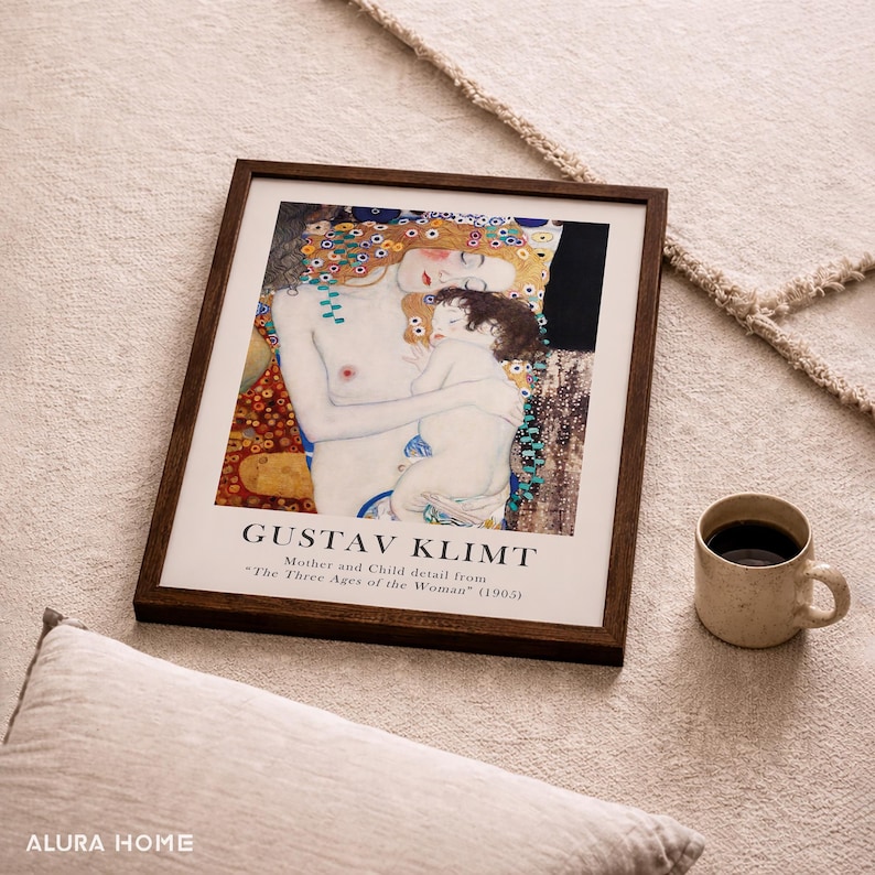 May include: A framed art print featuring a detail from Gustav Klimt's painting The Three Ages of the Woman, depicting a mother and child. The print includes the text GUSTAV KLIMT and Mother and Child detail from The Three Ages of the Woman (1905).