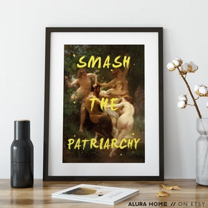 May include: A framed print of a painting depicting a group of people in a woodland setting. The text "SMASH THE PATRIARCHY" is superimposed over the image in yellow.