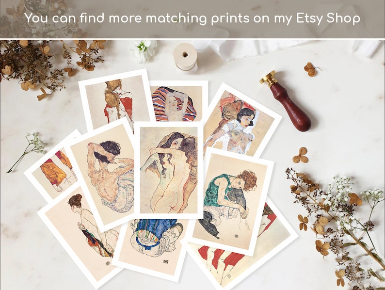 May include: A collection of 10 vintage art prints featuring nude figures in various poses. The prints are on white cardstock and have a cream-colored border. The prints are arranged in a circle on a white surface.