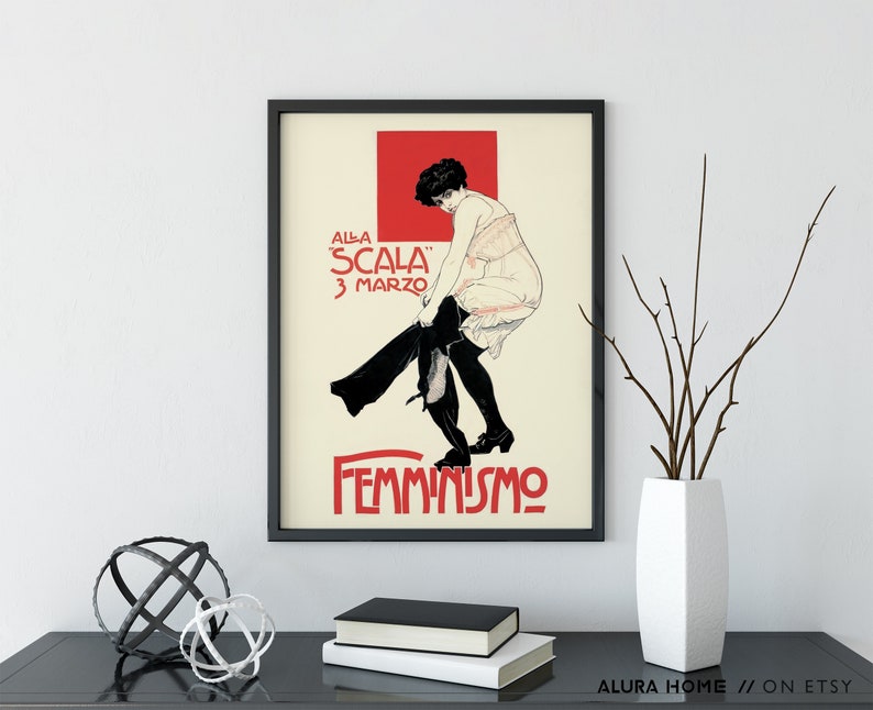 May include: A vintage poster advertising a performance at the "Scala" on March 3rd. The poster features a woman in a black dress and white stockings, with the word "FEMMINISMO" printed in large letters at the bottom.