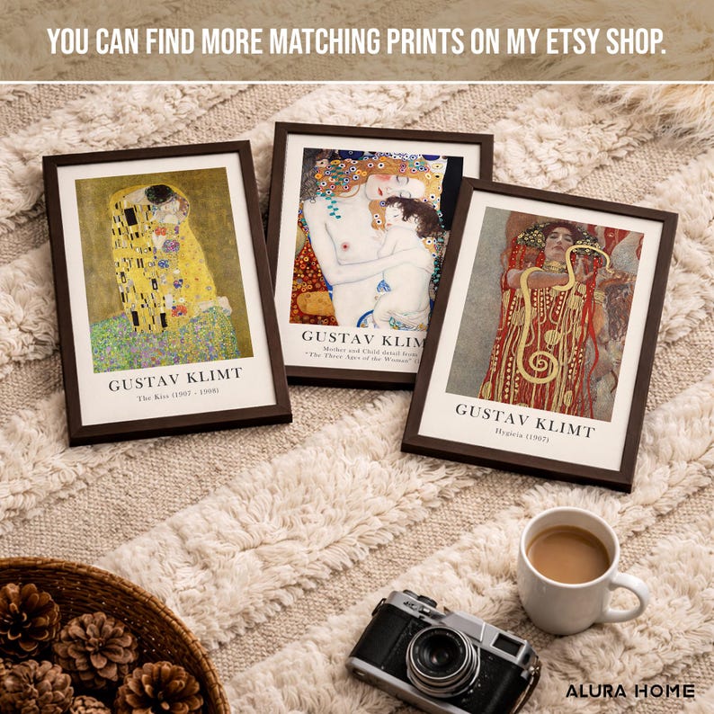 May include: Three framed art prints featuring Gustav Klimt paintings titled The Kiss, The Three Ages of Woman, and Hygieia. Each print is housed in a dark brown frame with white matting and black text identifying the artist and the artwork title.