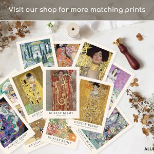 May include: A collection of rectangular art prints featuring various paintings by Gustav Klimt, each with a white border and the artist's name printed at the bottom. The prints display vibrant gold, red, blue, and green colors in intricate patterns.