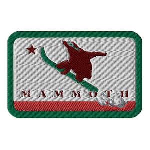 May include: A green, red, and white embroidered patch with a skier in silhouette and the word "MAMMOTH" in red.