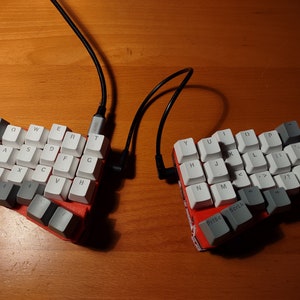 May include: A handmade, wooden cutting board with a natural finish. The board features a live edge on one side and a smooth, rectangular shape. It is approximately 18 inches long and 12 inches wide.