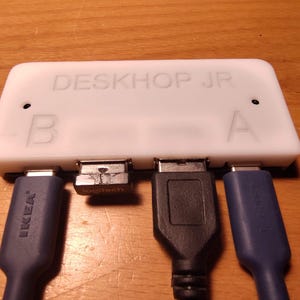 DeskHop Jr Keyboard Mouse Switch: seamless roaming for two computers, just move the mouse to the computer you want to use