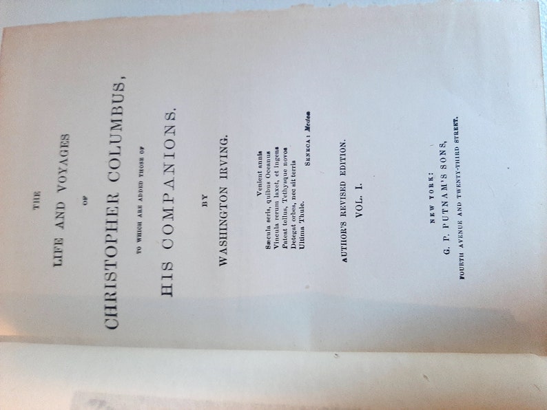 May include: A book titled "The Life and Voyages of Christopher Columbus" by Washington Irving. The book is a revised edition and was published by G.P. Putnam's Sons in New York.