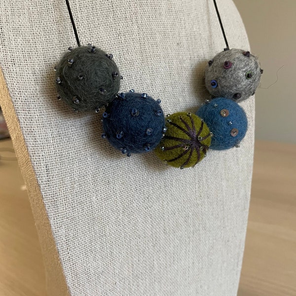Embroidered Felt Ball necklace on adjustable elastic cord