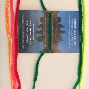 May include: Assortment of colorful friendship bracelets made by Buddhist nuns in Angkor Wat, Cambodia. Proceeds benefit Sam's Dream School in Siem Reap, Cambodia.  Each morning, we are born again. What we do today is what matters most. - Buddha