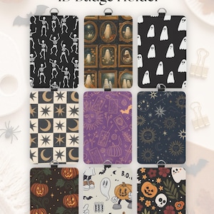 May include: Nine rectangular ID badge holders featuring various patterns including dancing skeletons, ghosts in ornate frames, simple white ghosts, celestial moons and stars, tarot cards, pumpkins, and skulls on black, purple, and cream backgrounds.