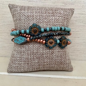 Three strand blue and copper beaded bracelet