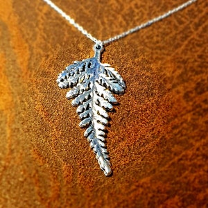 Fern pendant necklace in bright silver hotsell