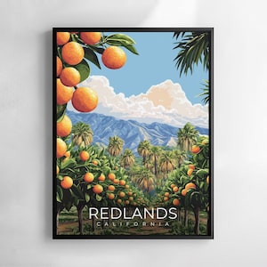 May include: A framed art print featuring a vibrant landscape of orange groves under a blue sky with fluffy clouds. The artwork includes palm trees, mountains, and the text "REDLANDS CALIFORNIA". The oranges are a bright orange color.