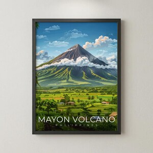 May include: A framed art print featuring a vibrant landscape of the Mayon Volcano in the Philippines. The artwork showcases a detailed illustration of the volcano, lush green fields, and a bright blue sky with fluffy clouds. The text "MAYON VOLCANO PHILIPPINES" is displayed at the bottom.