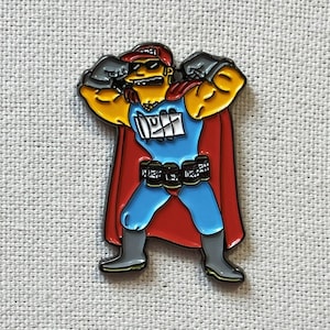 May include: A yellow cartoon superhero with a red cape, blue pants, and a black belt with silver buckles. The superhero is wearing a red hat with a white logo and has a black mustache and goatee. The superhero is flexing its biceps and has a determined expression on its face.