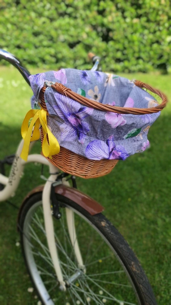 Pastel yellow bike with basket sales