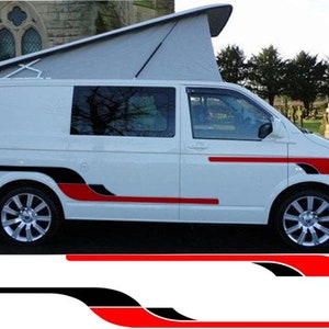 May include: White van with a pop-up roof and black and red racing stripes along the sides. The stripes are curved and have a sporty design.