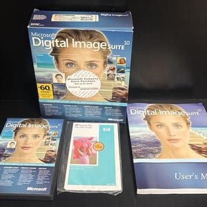 May include: A Microsoft Digital Image Suite 10 software package with a box, a user's manual, a CD-ROM, and a HP Premium Plus photo paper pack. The box and CD-ROM feature a woman's face. The user's manual is blue.