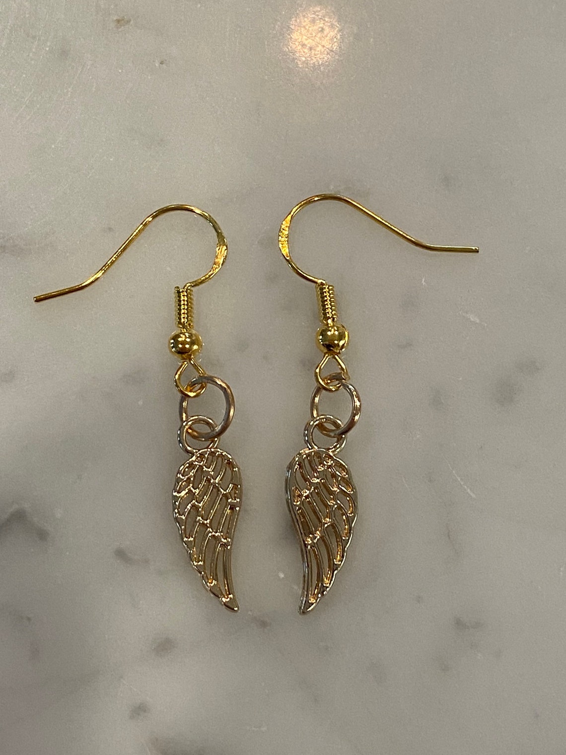 Gold angel wing earrings handcrafted Etsy