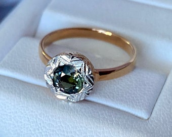 Superb ring in 9K rose gold set with a natural two-tone tourmaline 0.64 Cts size 54