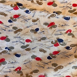 May include: A beige fabric with a repeating pattern of stylized birds in shades of brown, red, and blue. The birds are arranged in a random pattern and are surrounded by thin brown lines.