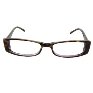 May include: Rectangular eyeglasses with a brown tortoiseshell pattern on the frames. The lenses are clear, and the inner rims have a subtle purple hue. The temples are a solid dark brown.