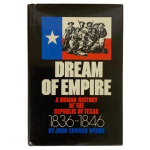 May include: A hardcover book titled "Dream of Empire" with a black cover. The cover features the Texas flag and an illustration of historical figures. The text reads "A Human History of the Republic of Texas 1836-1846".