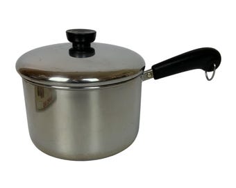 Revere Ware 3 Qt roestvrijstalen steelpan met deksel en zwart handvat, vintage 1993