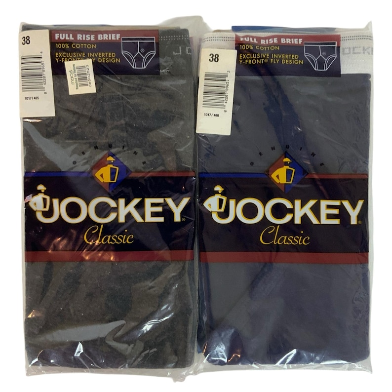 May include: Two pairs of Jockey Classic underwear in gray and navy blue. The packaging features the Jockey logo and the text "Full Rise Brief, 100% Cotton, Exclusive Inverted Y-Front Fly Design".