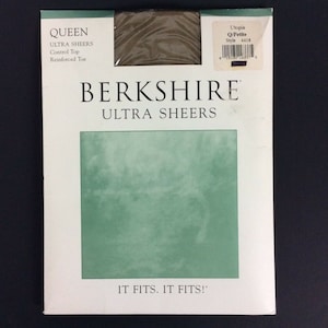 May include: A pack of Berkshire Ultra Sheers tights in a brown colour. The packaging features the brand name and product description, along with the text "It Fits. It Fits!"