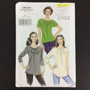 May include: A sewing pattern for a women's top with a gathered neckline. The pattern is for sizes 6-8-10-12 and is from Vogue Very Easy. The pattern shows three different styles of tops, one with a bow, one with a gathered neckline, and one with a gathered neckline and a ruffle.