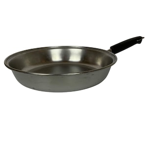 May include: A stainless steel frying pan with a black handle. The pan is round with a slightly sloped side and a flat bottom. The handle is made of a black, heat-resistant material.