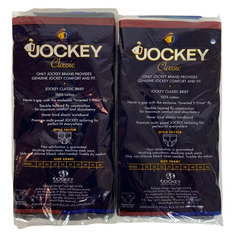 May include: Two packages of Jockey Classic brand underwear. The packages are blue and black with white text. The text on the packages reads "Jockey Classic", "Only Jockey Brand Provides Genuine Jockey Comfort and Fit", "Jockey Classic Brief", "100% Cotton", "Never a gap with the exclusive "Inverted Y-Front" Fly", "Double-layered fly construction for maximum comfort and absorbency", "Never-bind elastic waistband", "Premium multi-panel Jockey tailoring for perfect fit everywhere", "Style 1017CR", "Your satisfaction is guaranteed", "Washing instructions: Machine wash warm. Only non-chlorine bleach when needed. Tumble dry medium.", "Size Chart", "28 30 32 34 36 38 40 42 44".