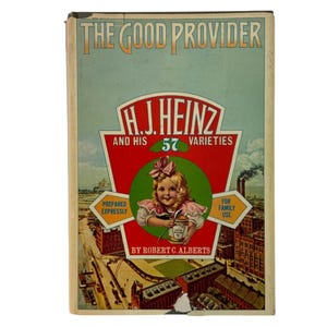 May include: Vintage advertisement for H.J. Heinz and his 57 varieties. The image features a young girl holding a jar of apple butter, with text that reads "The Good Provider." The background includes illustrations of factories and the text "Prepared Expressly" and "For Family Use."