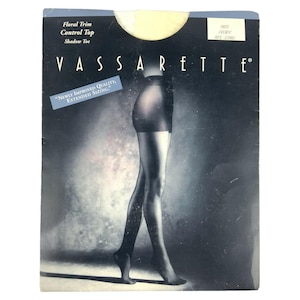 May include: Vassarette control top pantyhose in an ivory color, with a shadow toe and floral trim. The packaging includes the text "Newly Improved Quality, Extended Sizing."