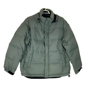 May include: A sage green puffer jacket with a high collar and a full-zip closure. The jacket has a quilted design, two front pockets, and black trim on the cuffs and collar. The jacket is designed for cold weather.