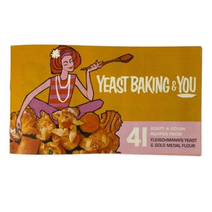 May include: A vintage recipe booklet titled Yeast Baking & You with a mustard yellow cover featuring an illustration of a person holding a wooden spoon. The text reads 41 Adapt-A-Dough Recipes from Fleischmann's Yeast & Gold Medal Flour.