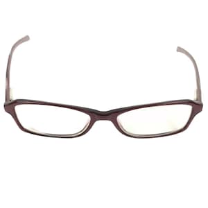 May include: A pair of rectangular eyeglasses with a dark burgundy frame. The lenses are clear, and the temples curve gently. The glasses are designed for vision correction and are suitable for everyday use.